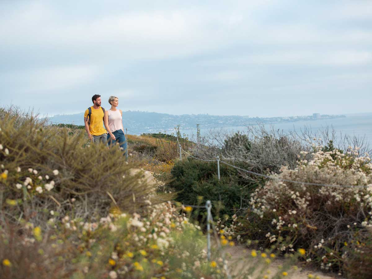 couple hiking near Del Mar, CA