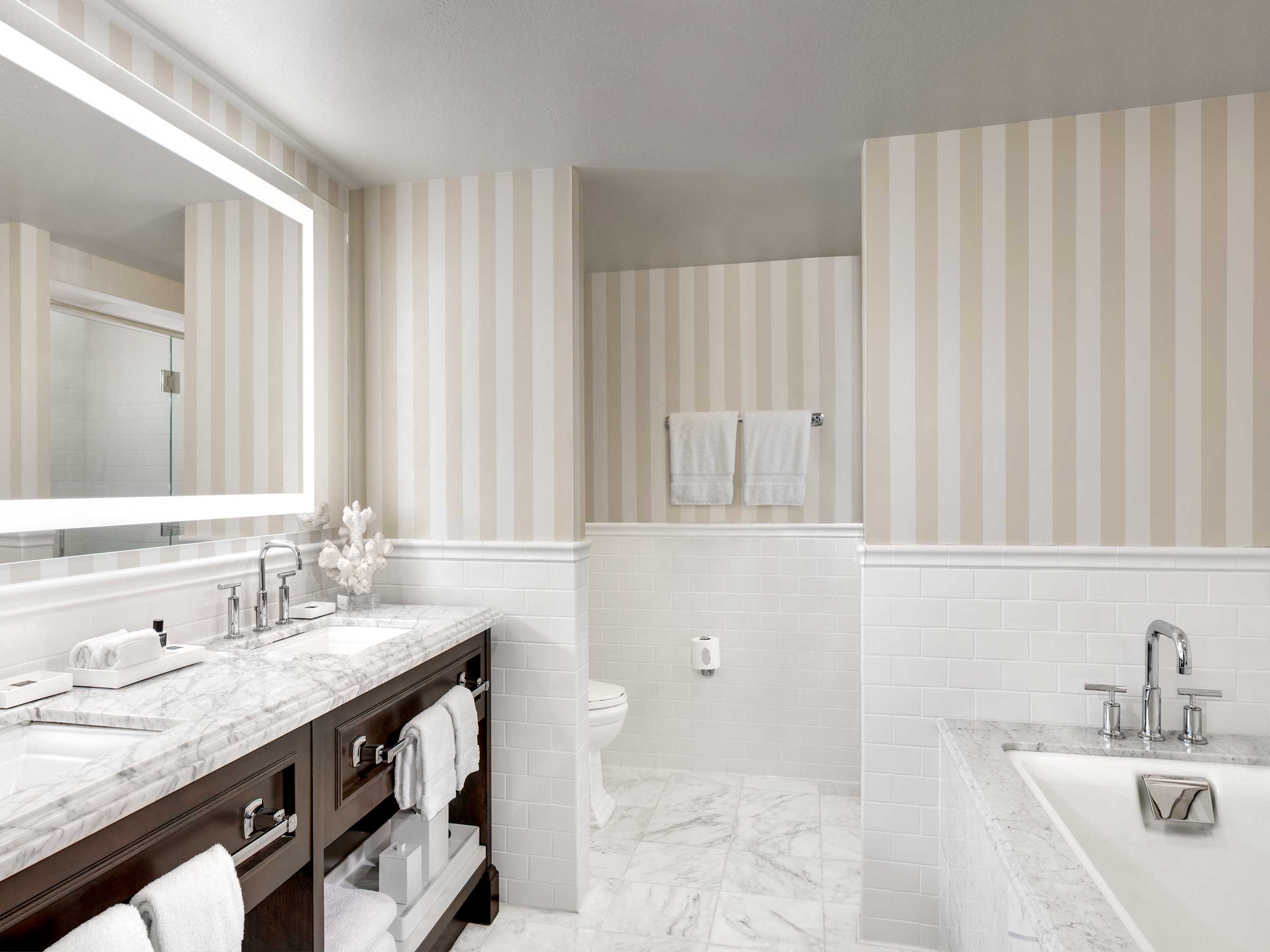 Bathroom with deep soaking tub at L'Auberge Del Mar