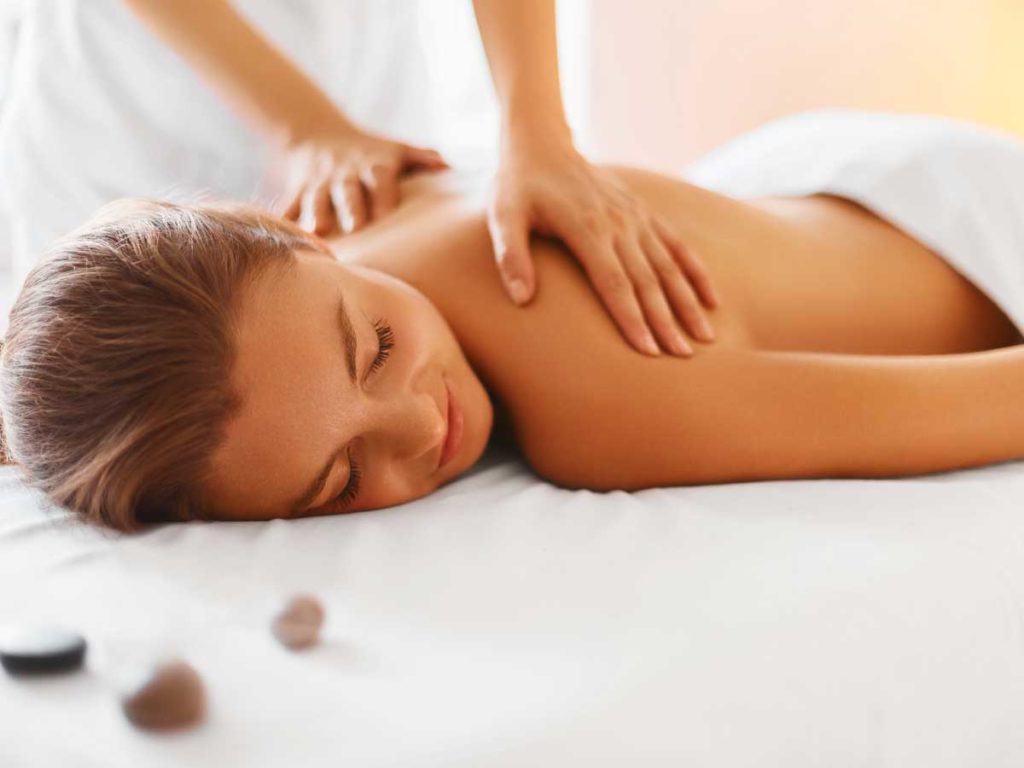 Woman at spa in L'Auberge Del Mar getting a massage