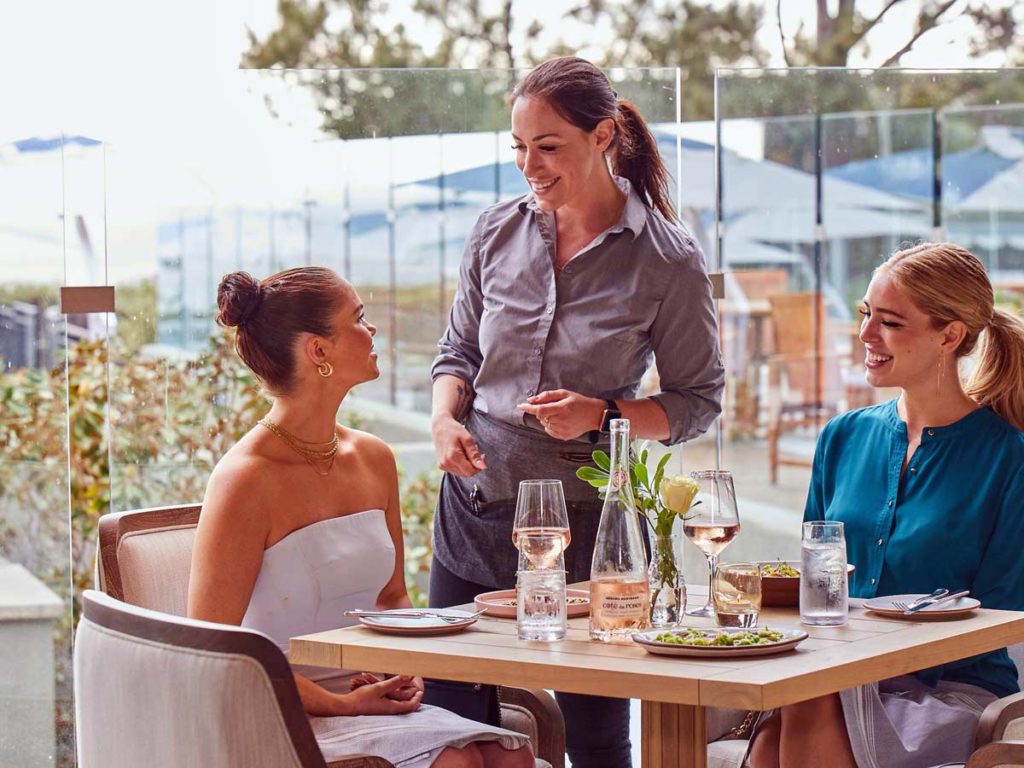 Friends Eating Outdoors At LAuberge.