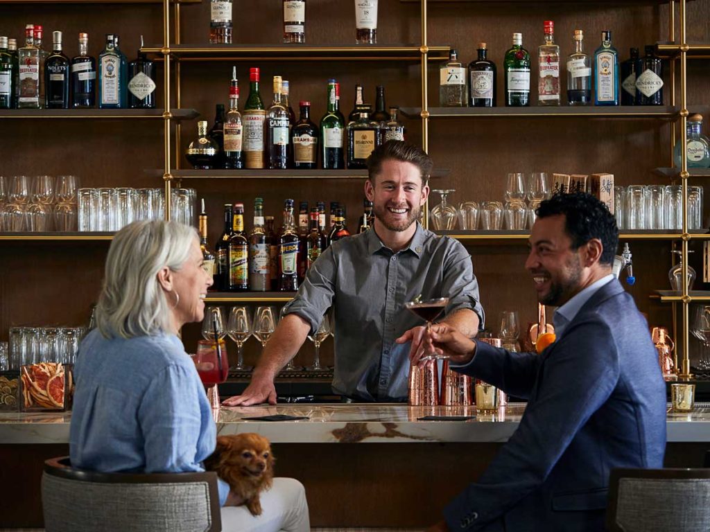 Couple Having Drinks At The Bar.