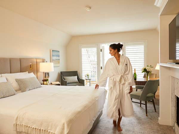 Lady In A Robe In LAuberge Guest Room.