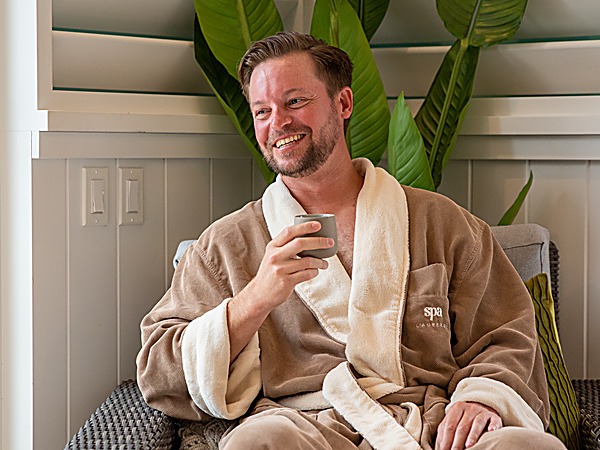 Man unwinding with tea in a cozy robe at L'Auberge Del Mar Spa in Del Mar, California